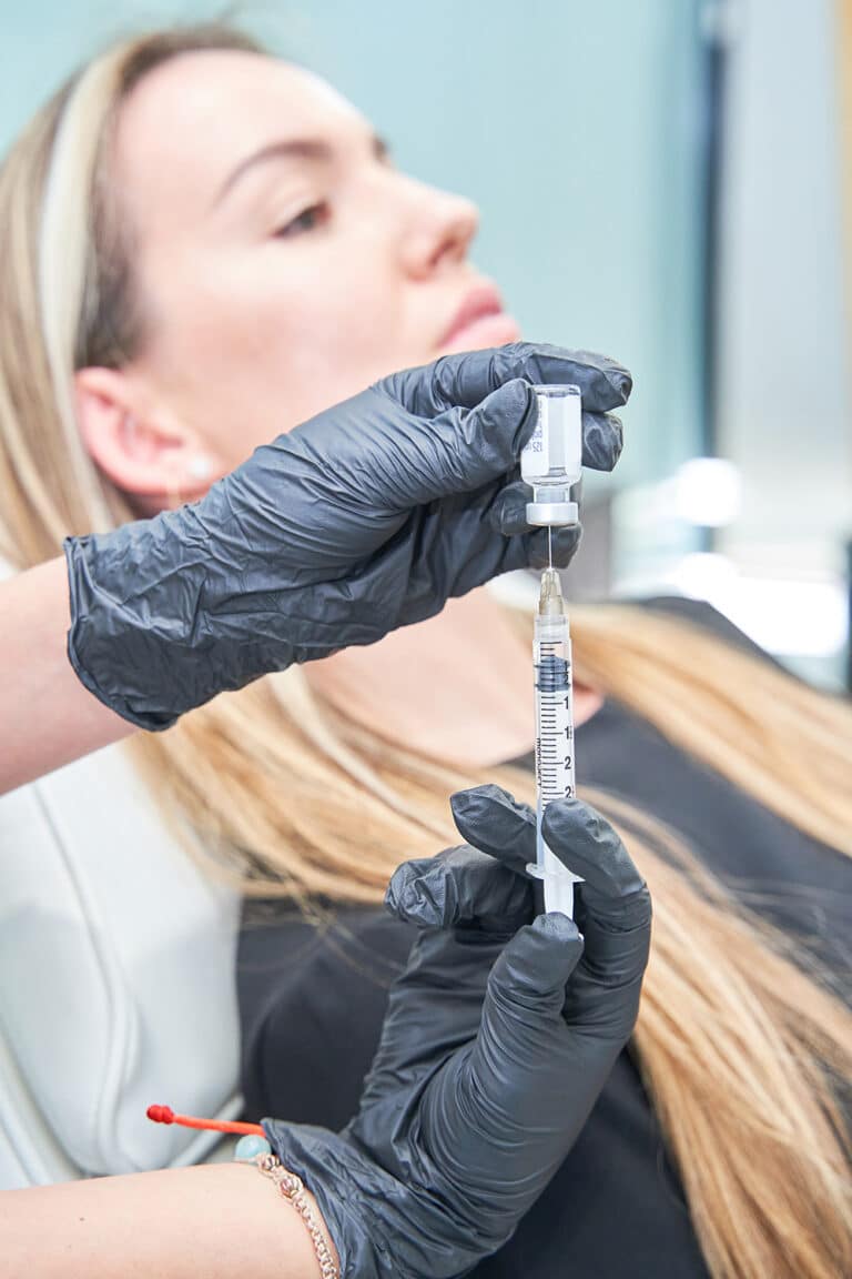 a-woman-is-carrying-a-syringe-the-syringe-is-whit-2025-01-16-03-03-27-utc