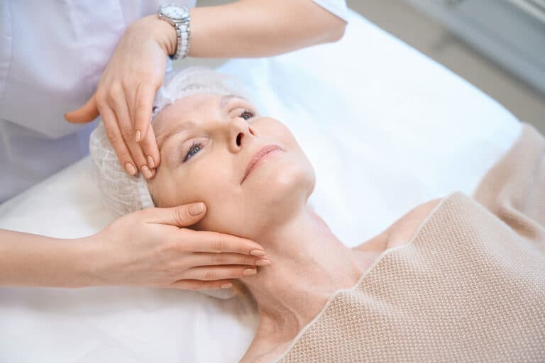 top-view-of-mature-woman-in-cosmetic-cap-getting-f-2024-10-21-22-23-57-utc
